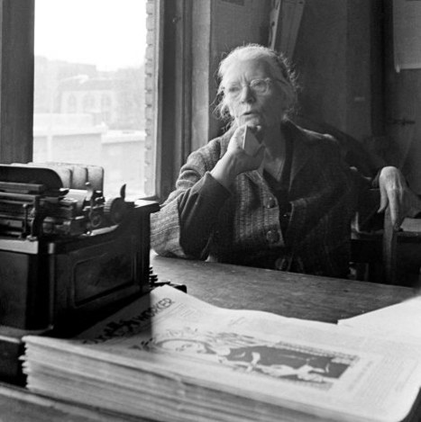 Dorothy Day at the typewriter in the office of the Catholic Worker in New York in the 1950s.